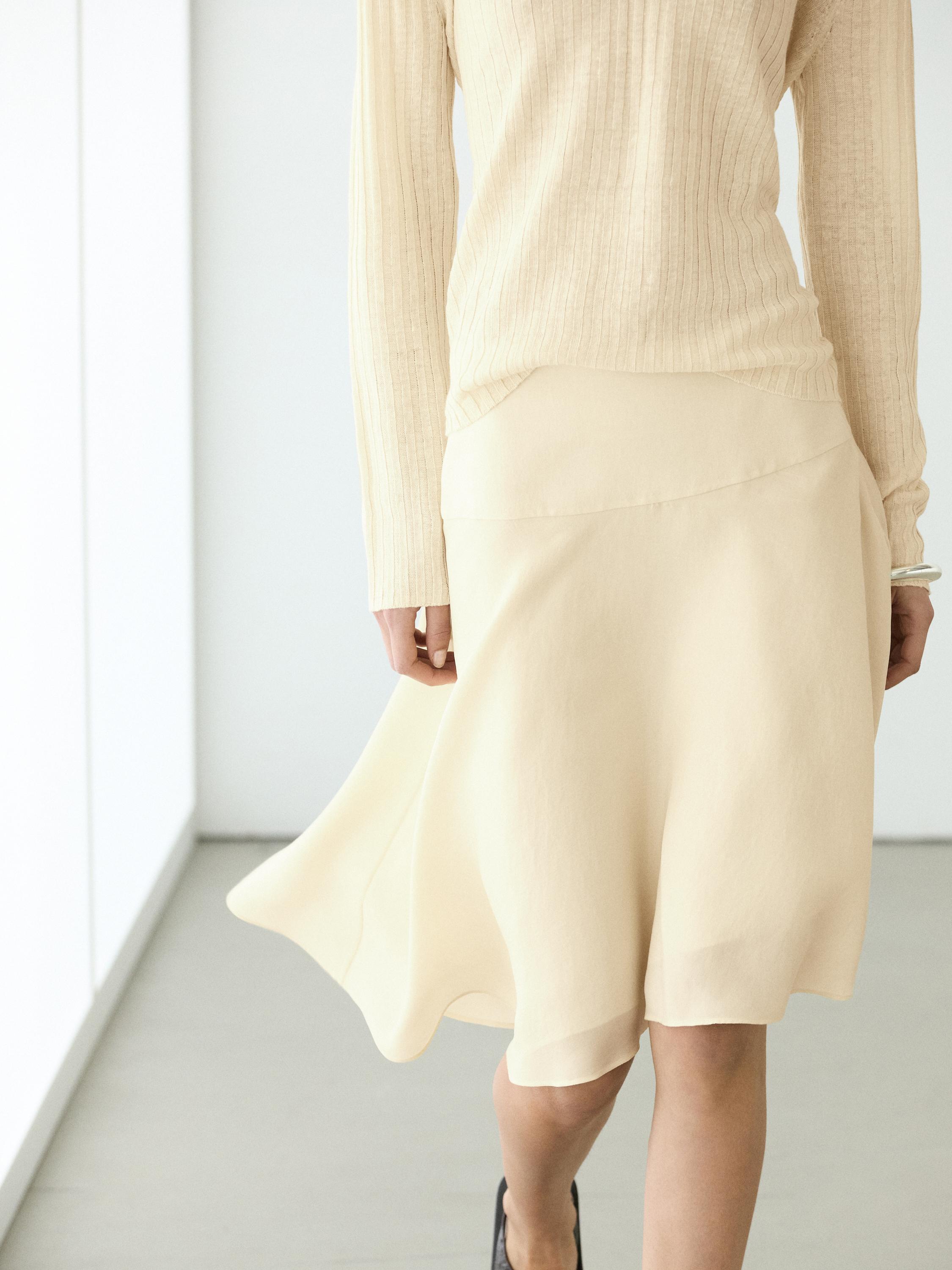 Flowing asymmetric midi skirt