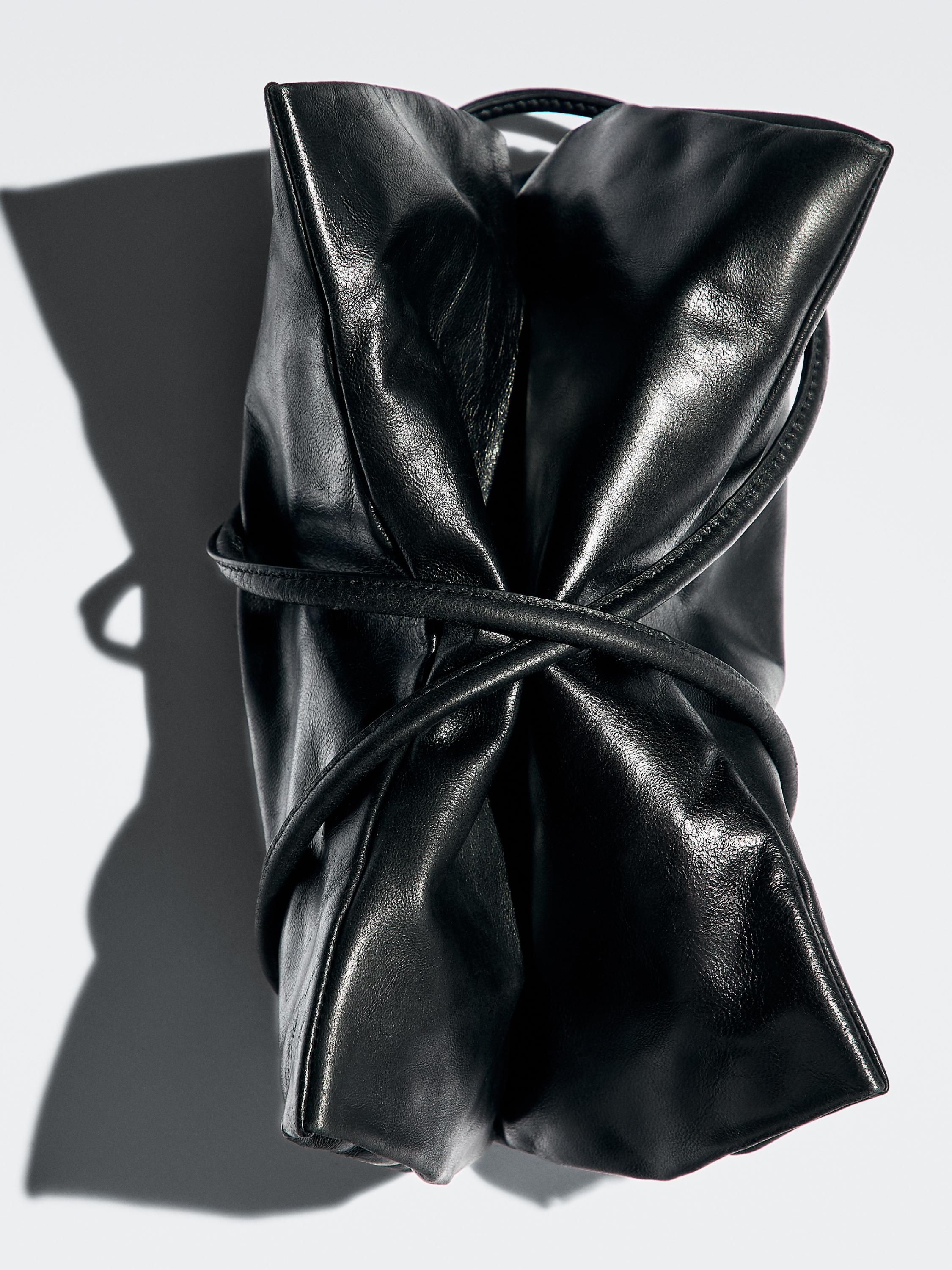 Small nappa leather bag with compartments