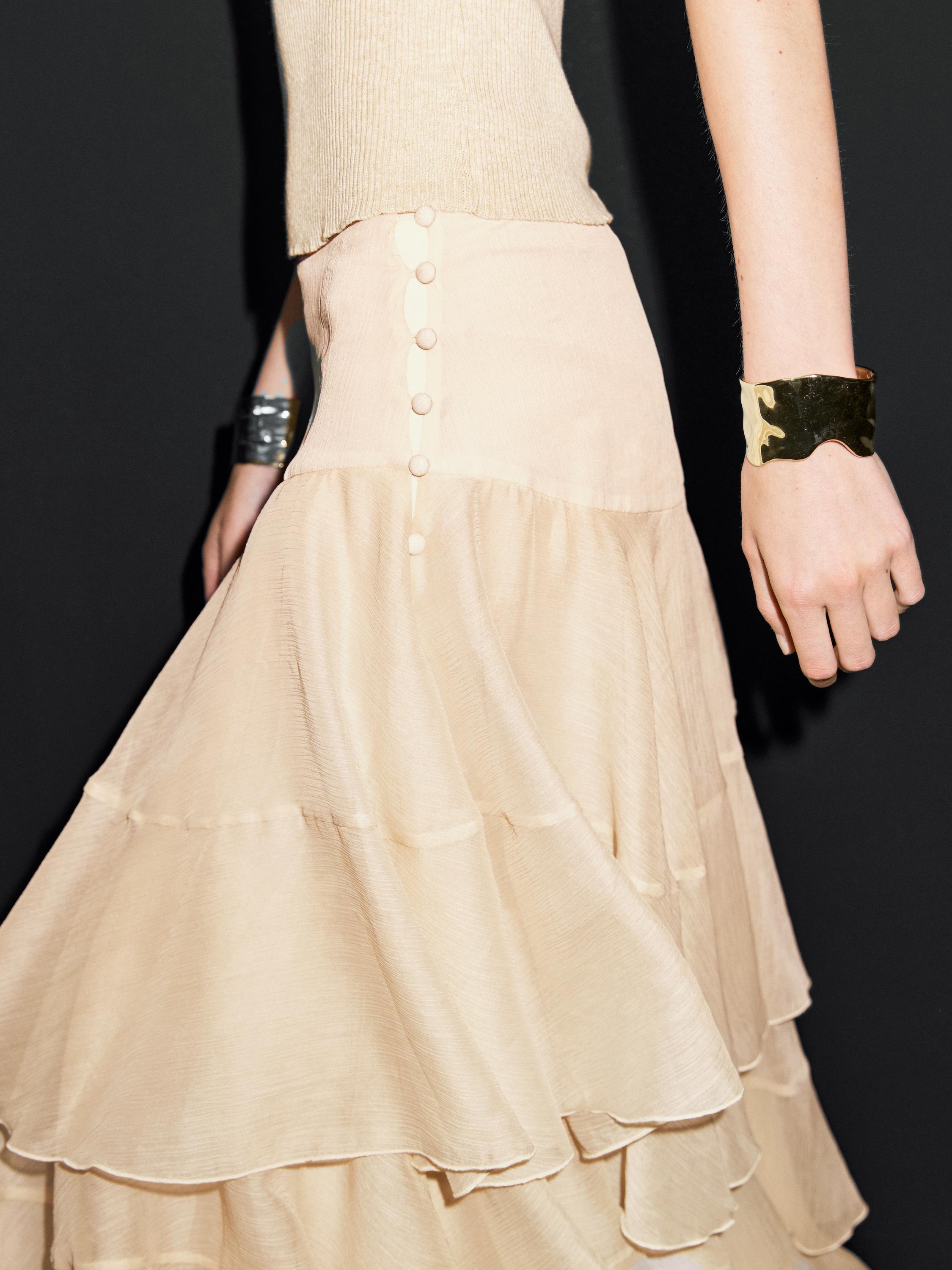 Long ruffled skirt with sash