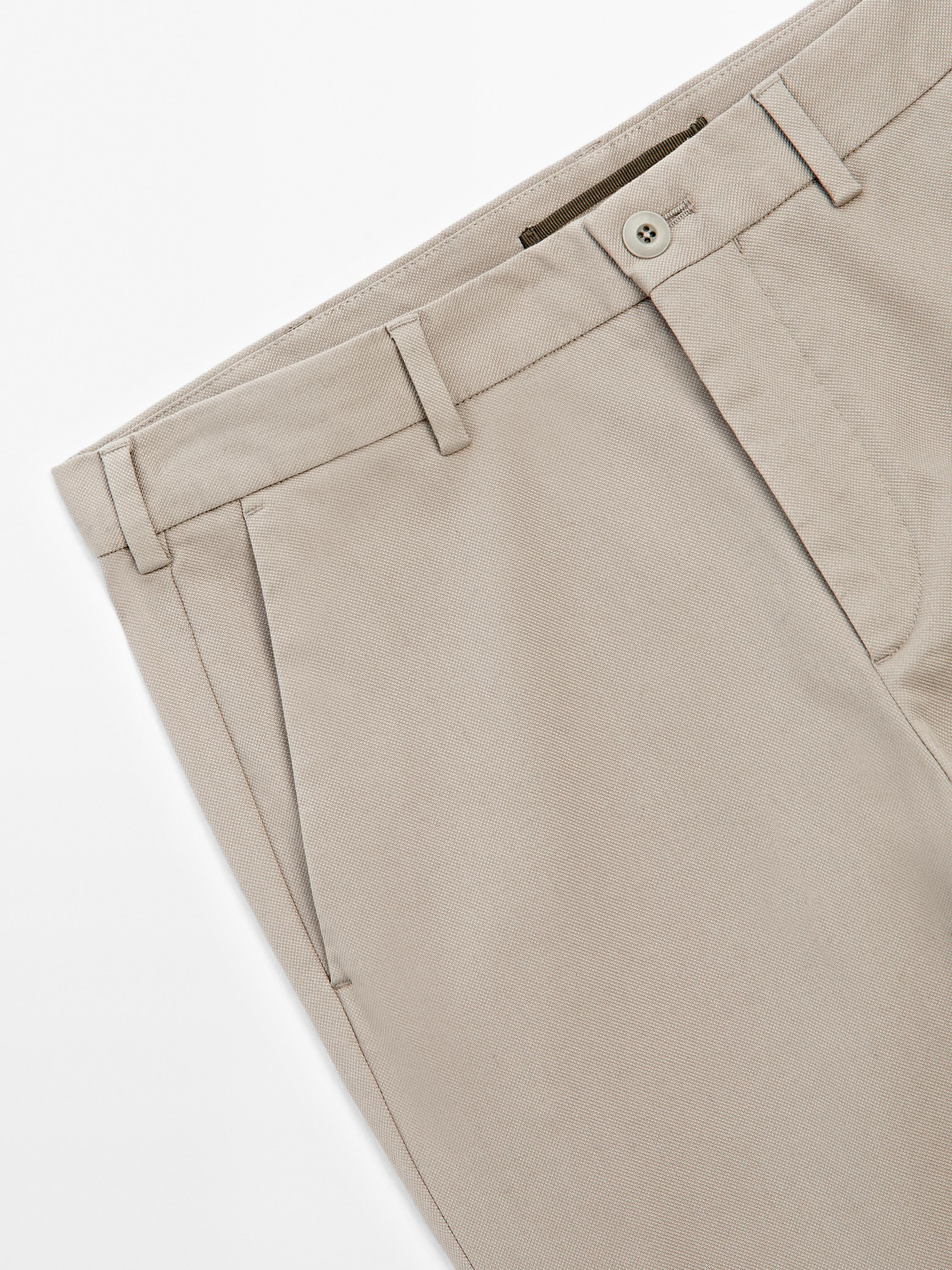 Cotton blend textured slim fit trousers