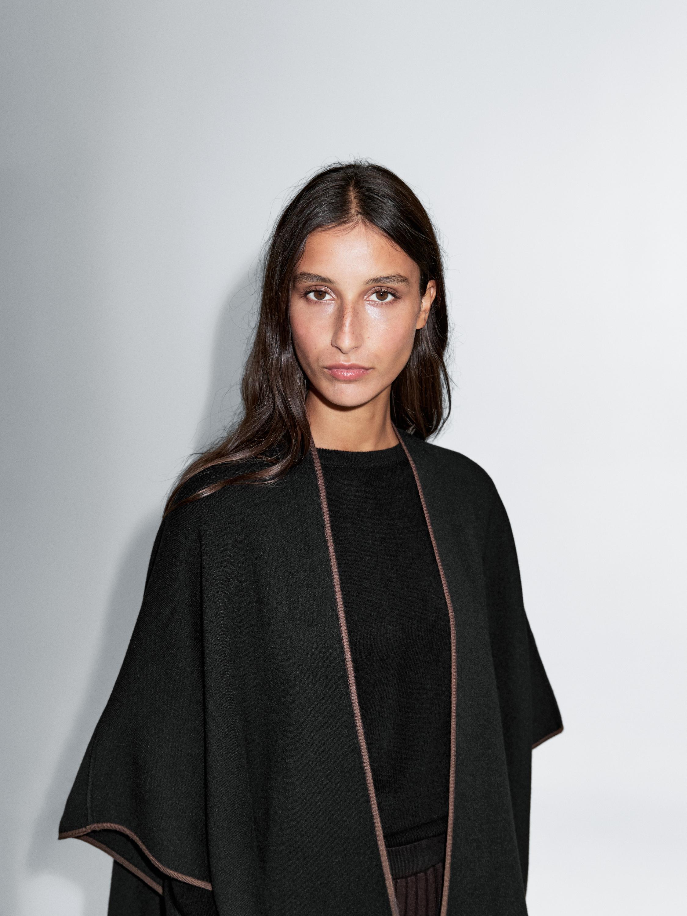 Knit cape with contrast detail