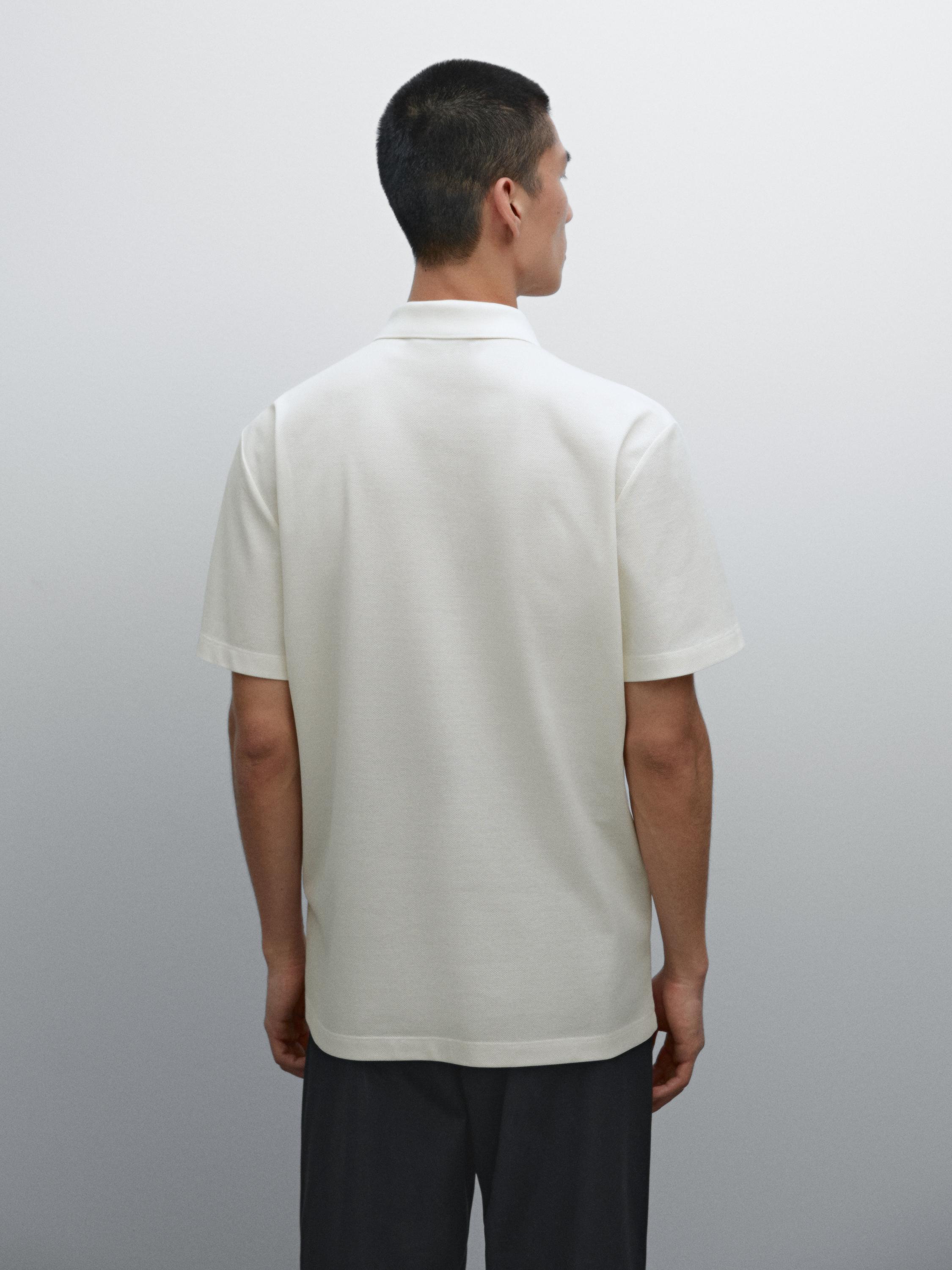 قميص بولو قطن 100% بنسيج دقيق بارز الملمس