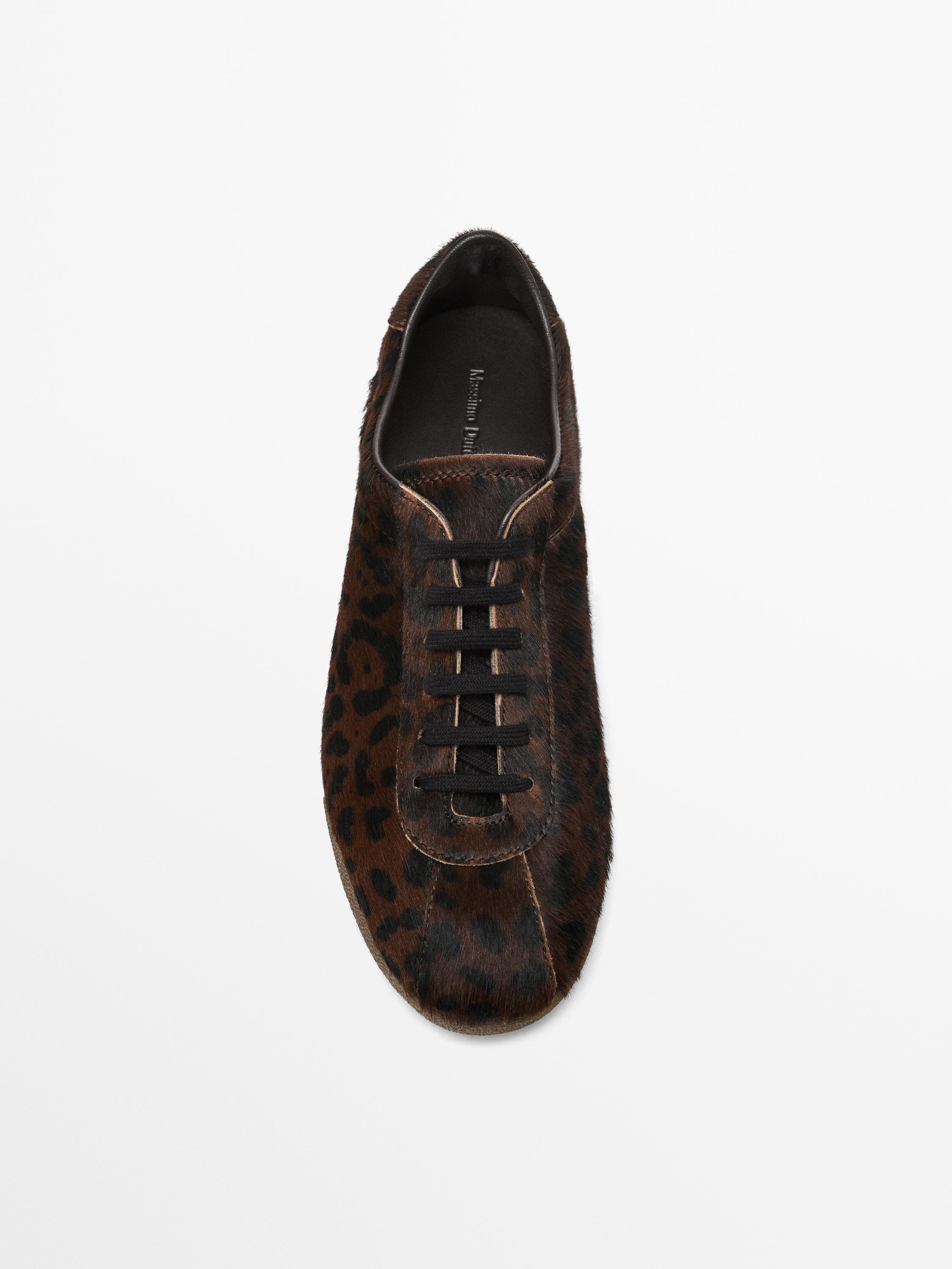 Leopard print hair on leather trainers