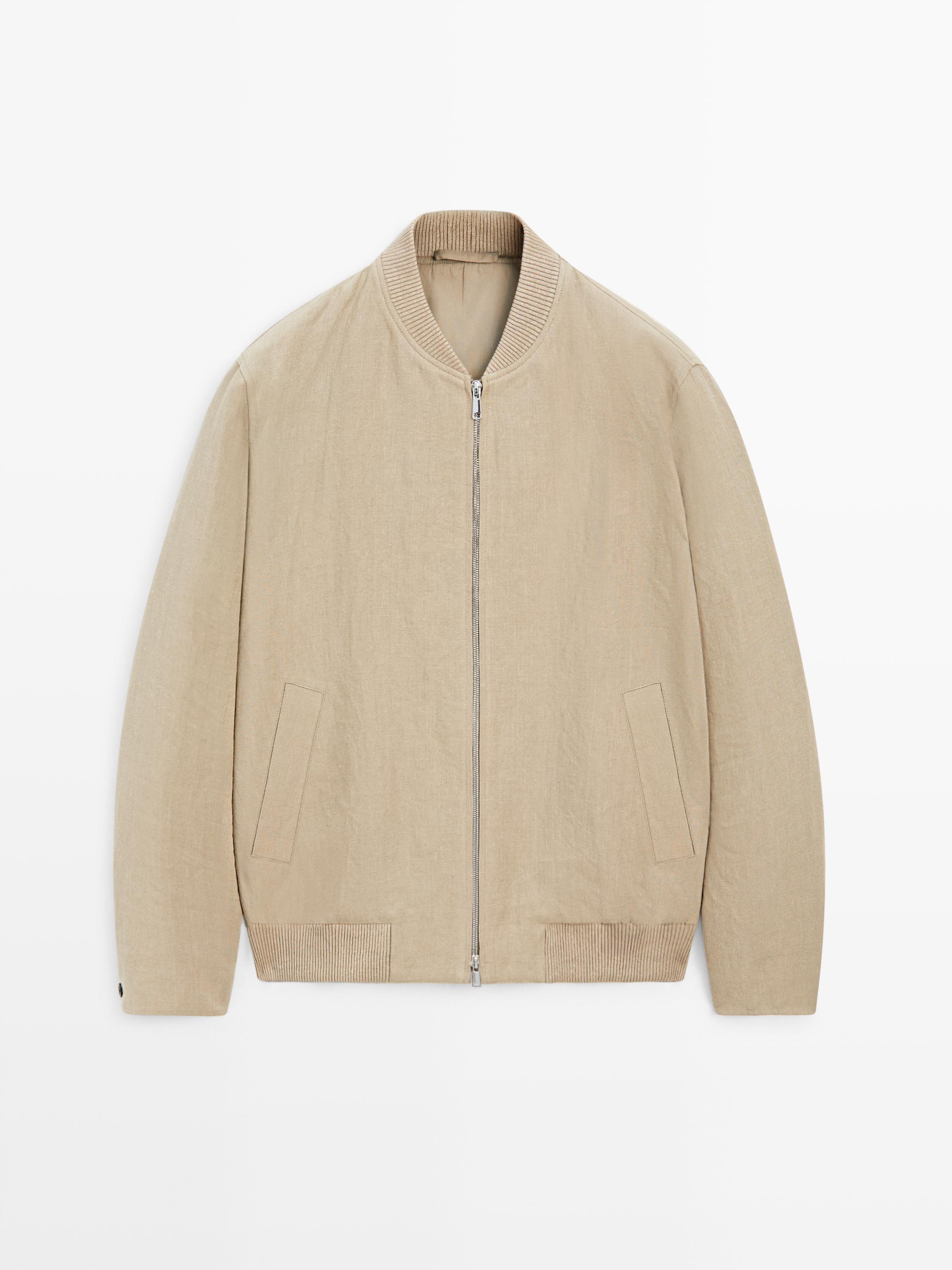 Front view of a beige bomber jacket with a central zipper, ribbed round neck, and side pockets.