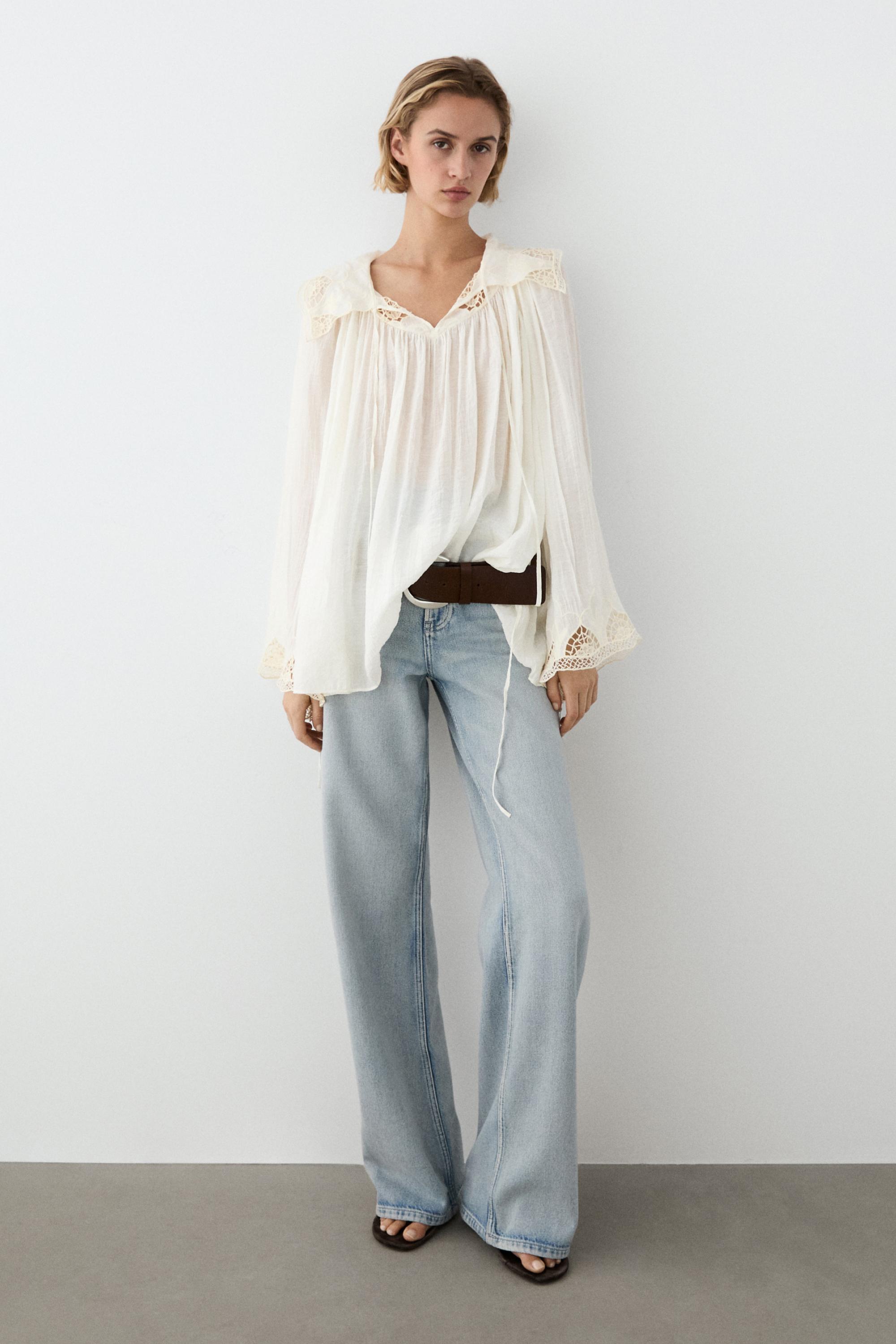 Blusa fluida com pormenor de bordados