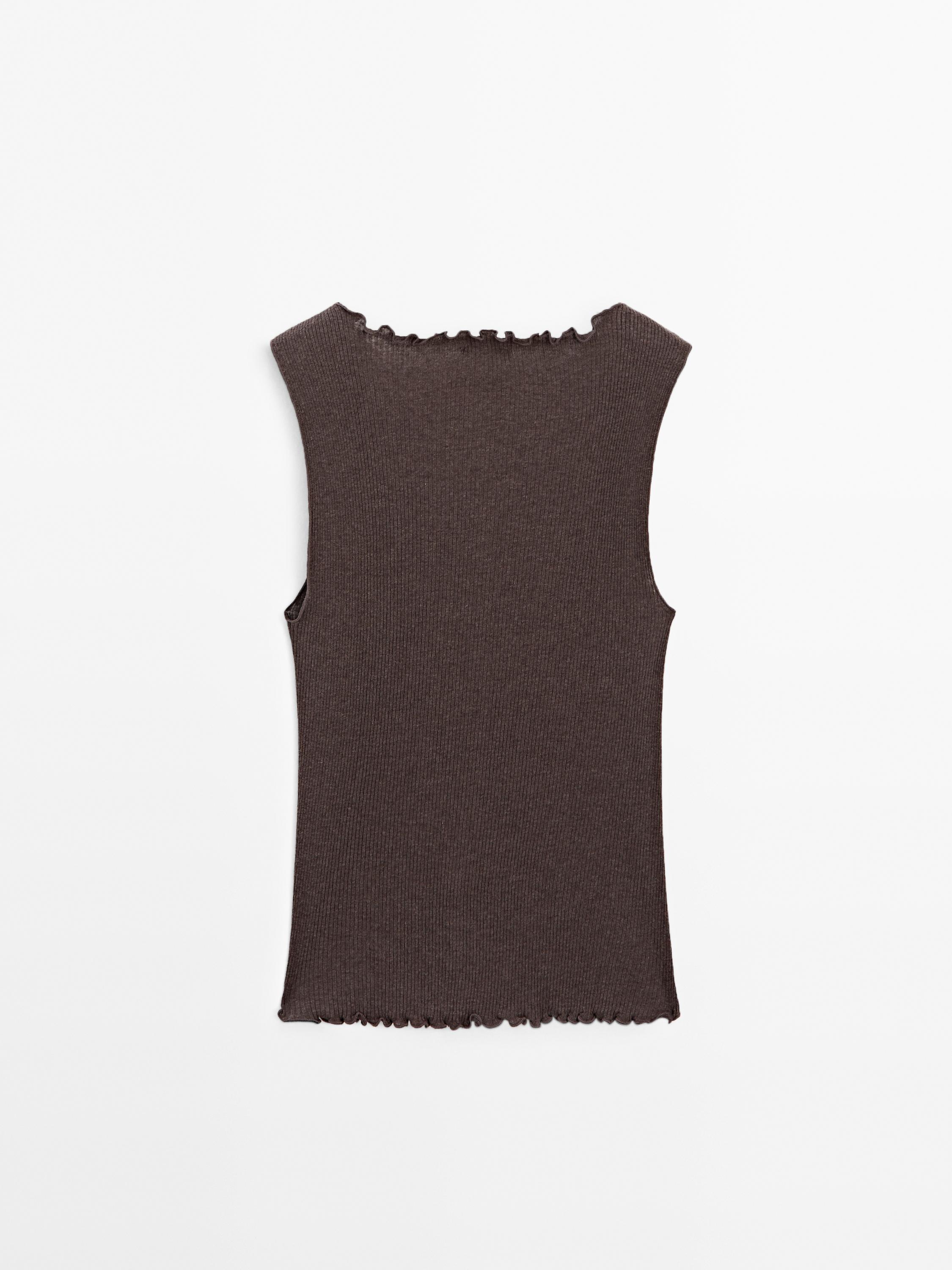 Knit waistcoat top with buttoned strap