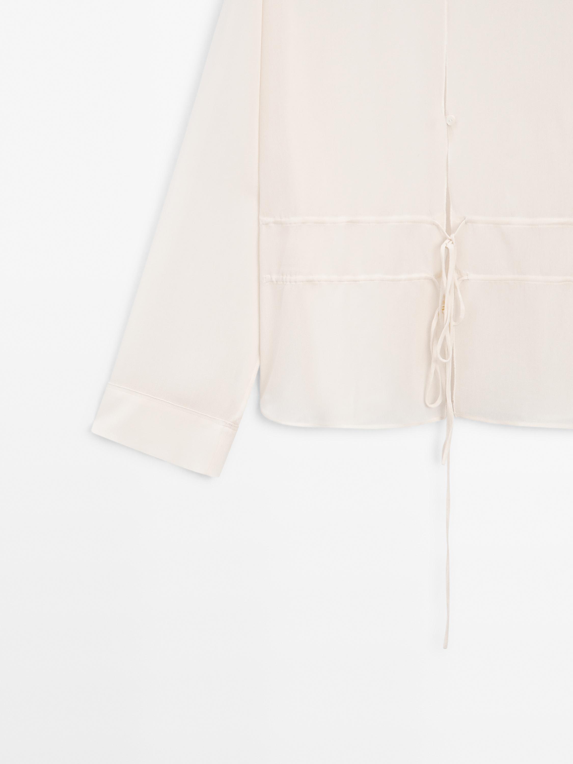 Flowing semi-sheer blouse with ties