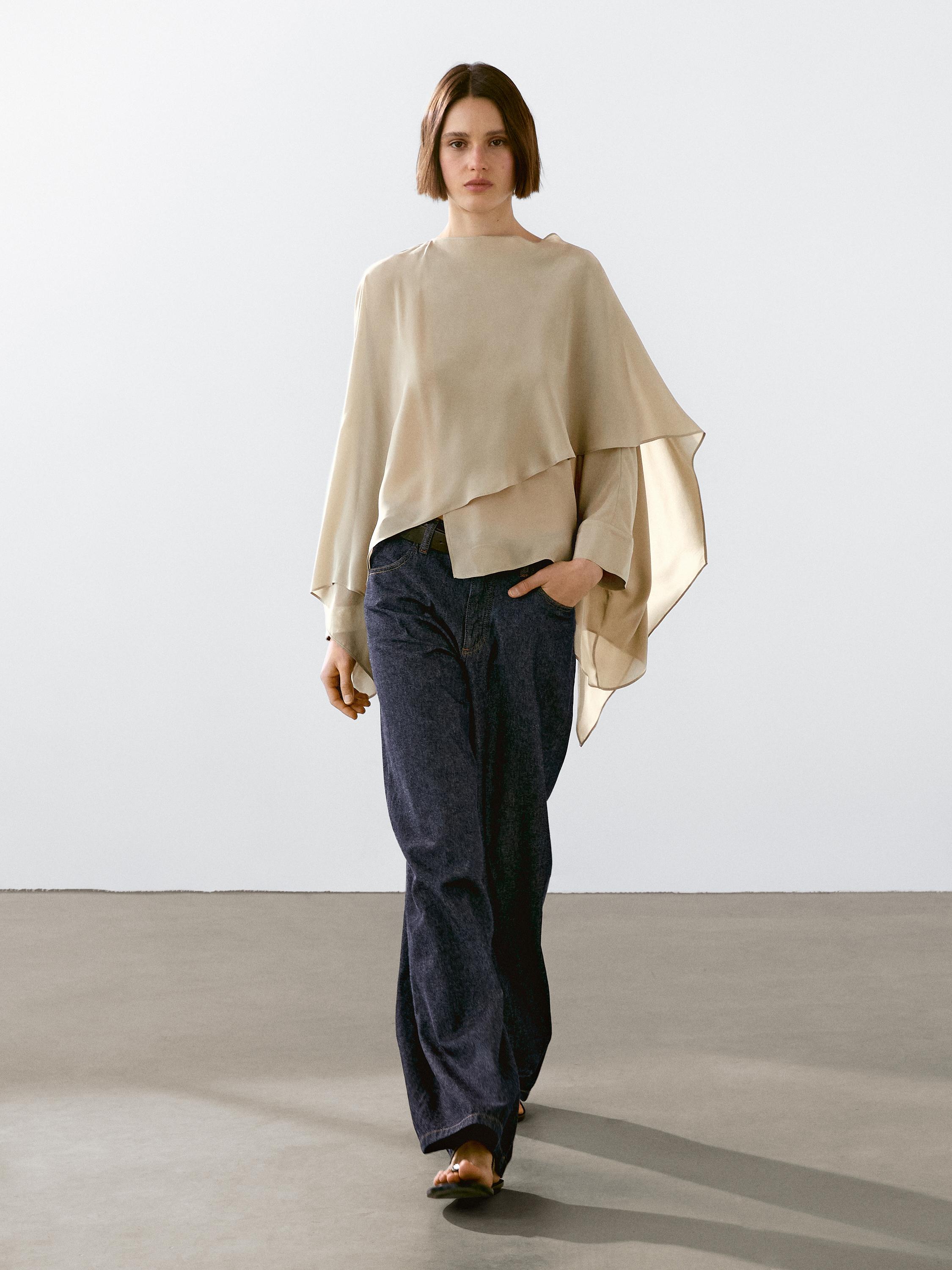 Flowing cape with a satin finish