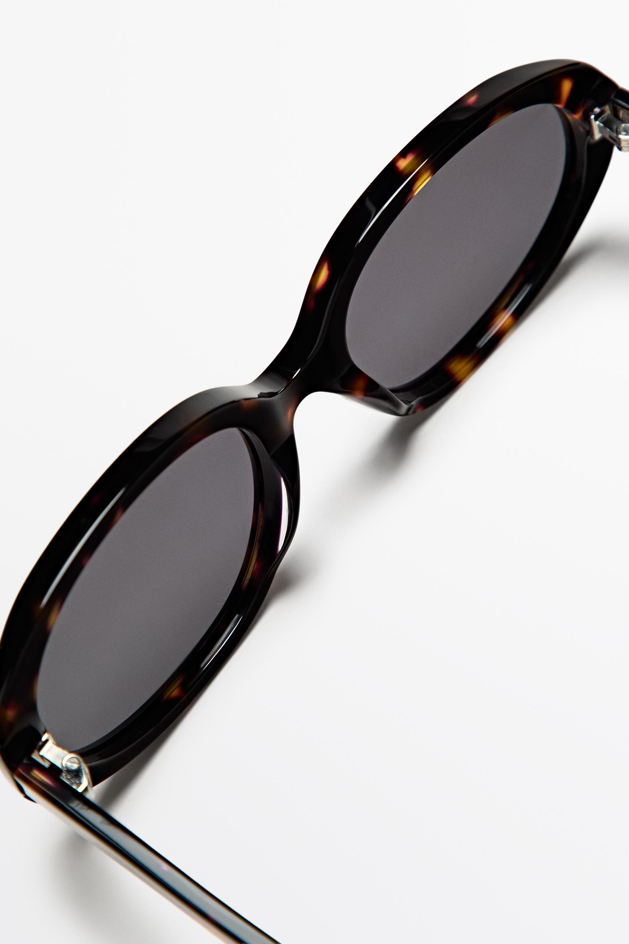 Oval tortoiseshell-effect sunglasses — BROWN