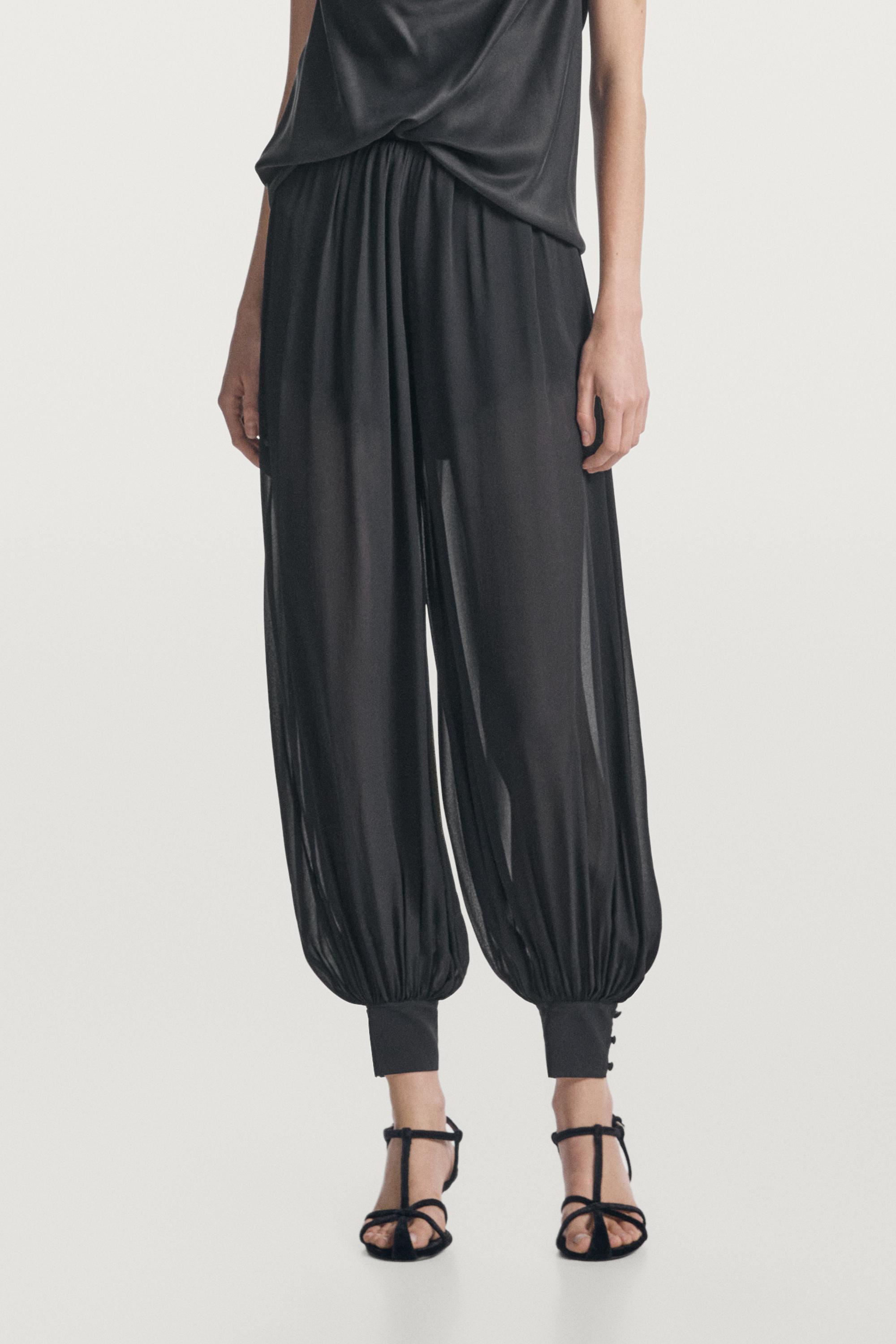 Semi-sheer sarouel trousers with button details — BLACK