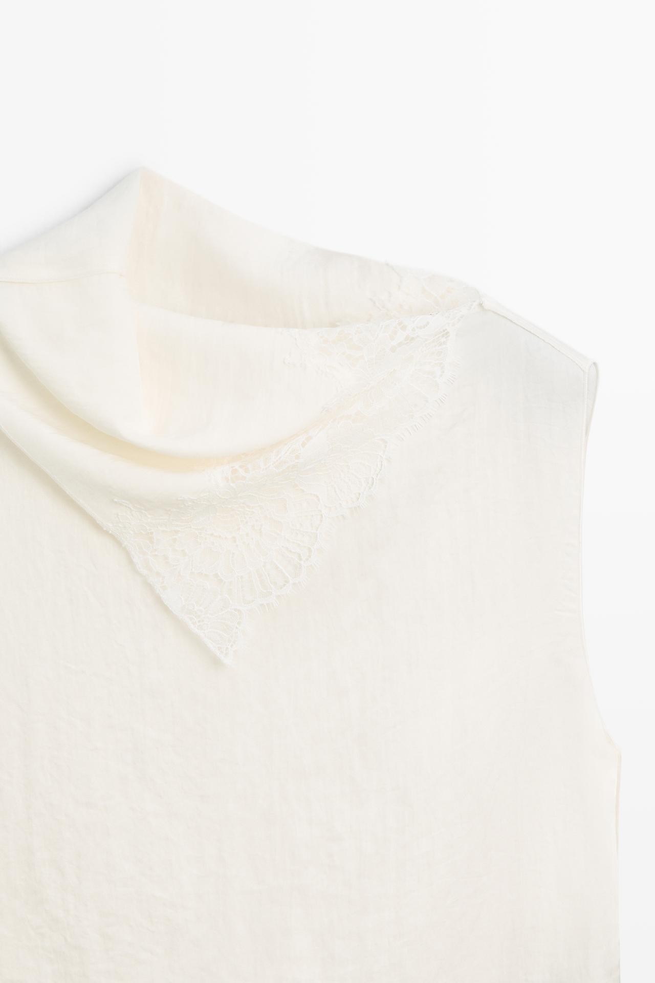 Asymmetric roll neck top with lace detail — CREAM