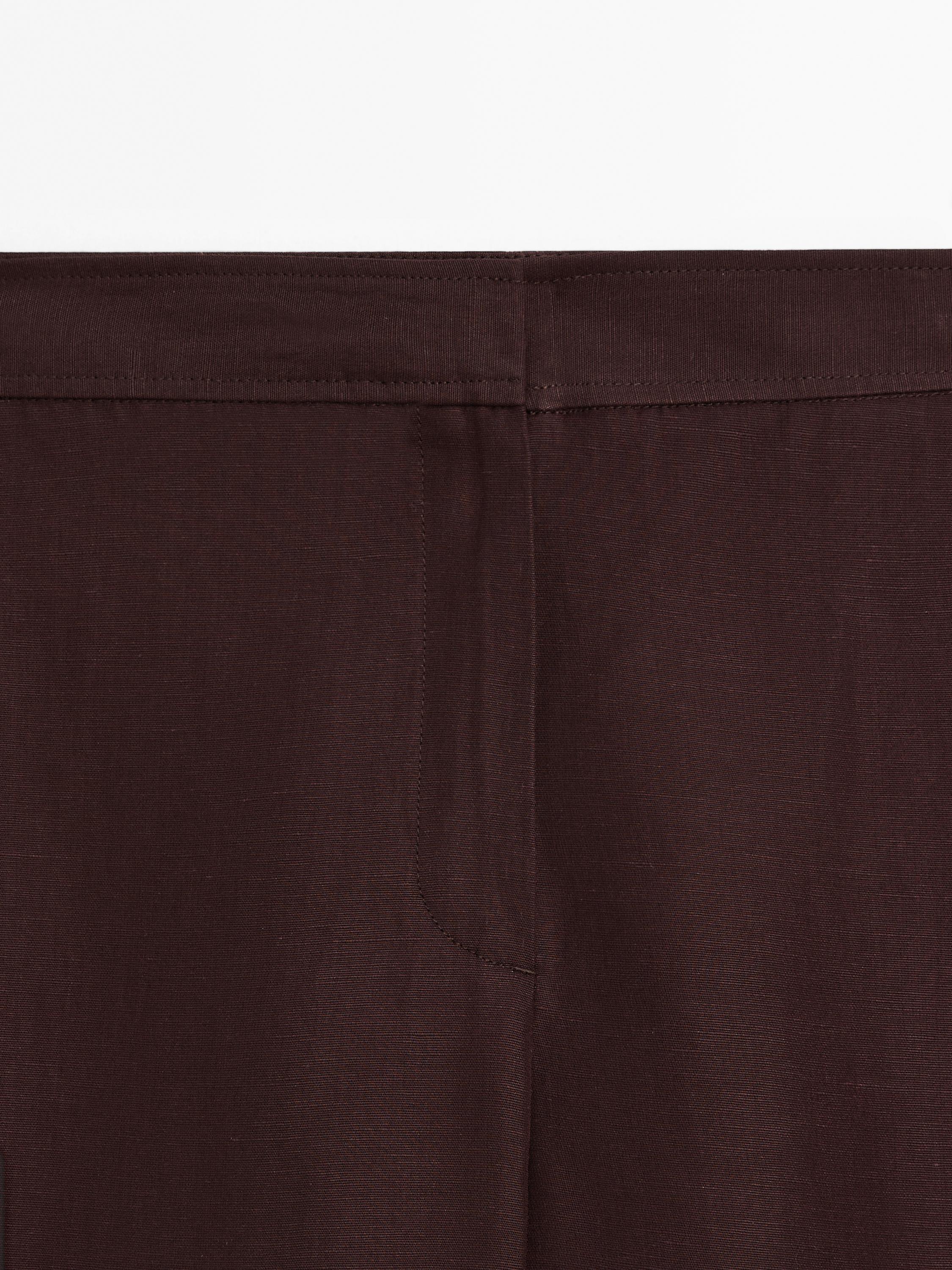 Flowing trousers with side vents