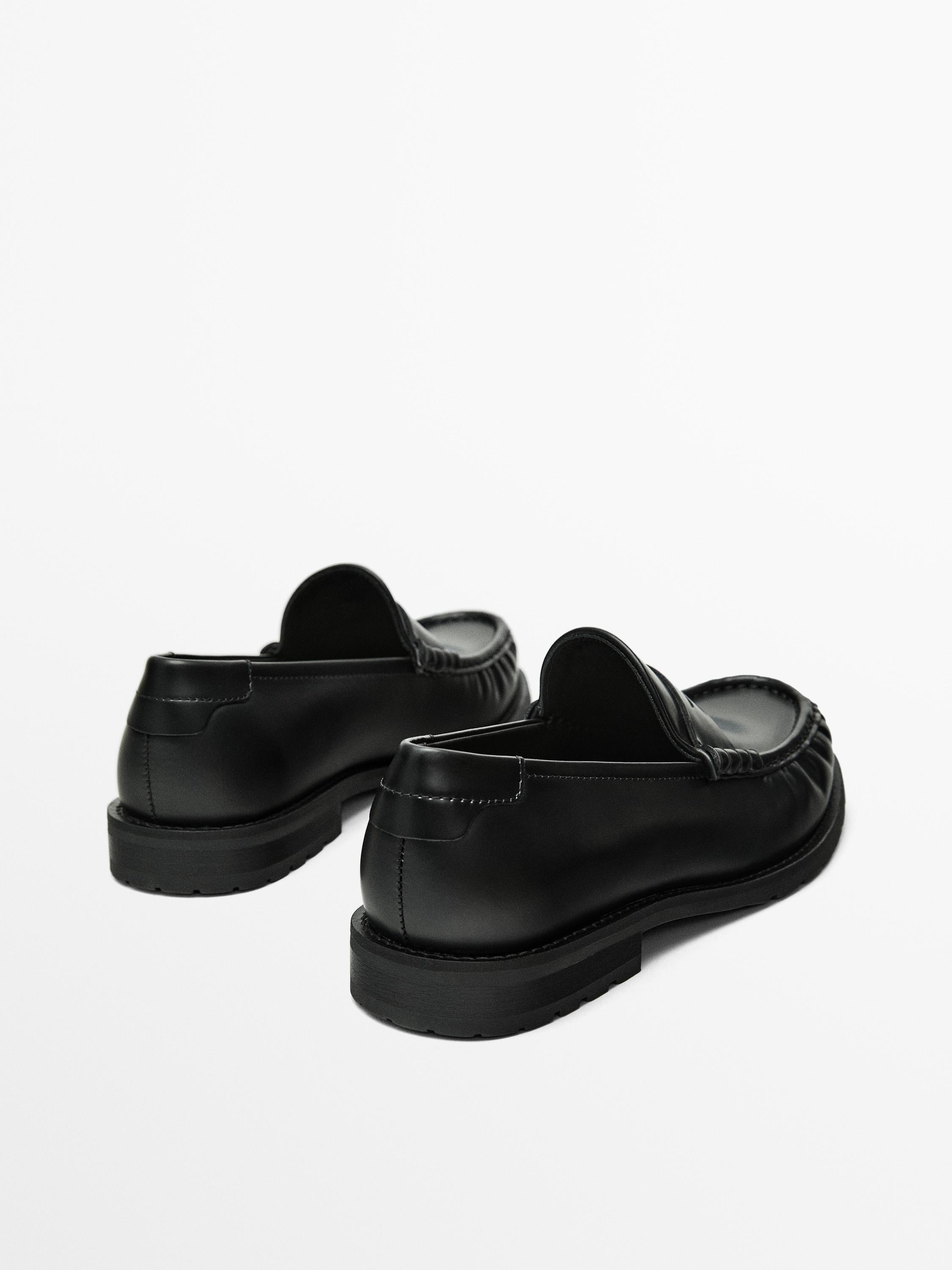 Black leather loafers