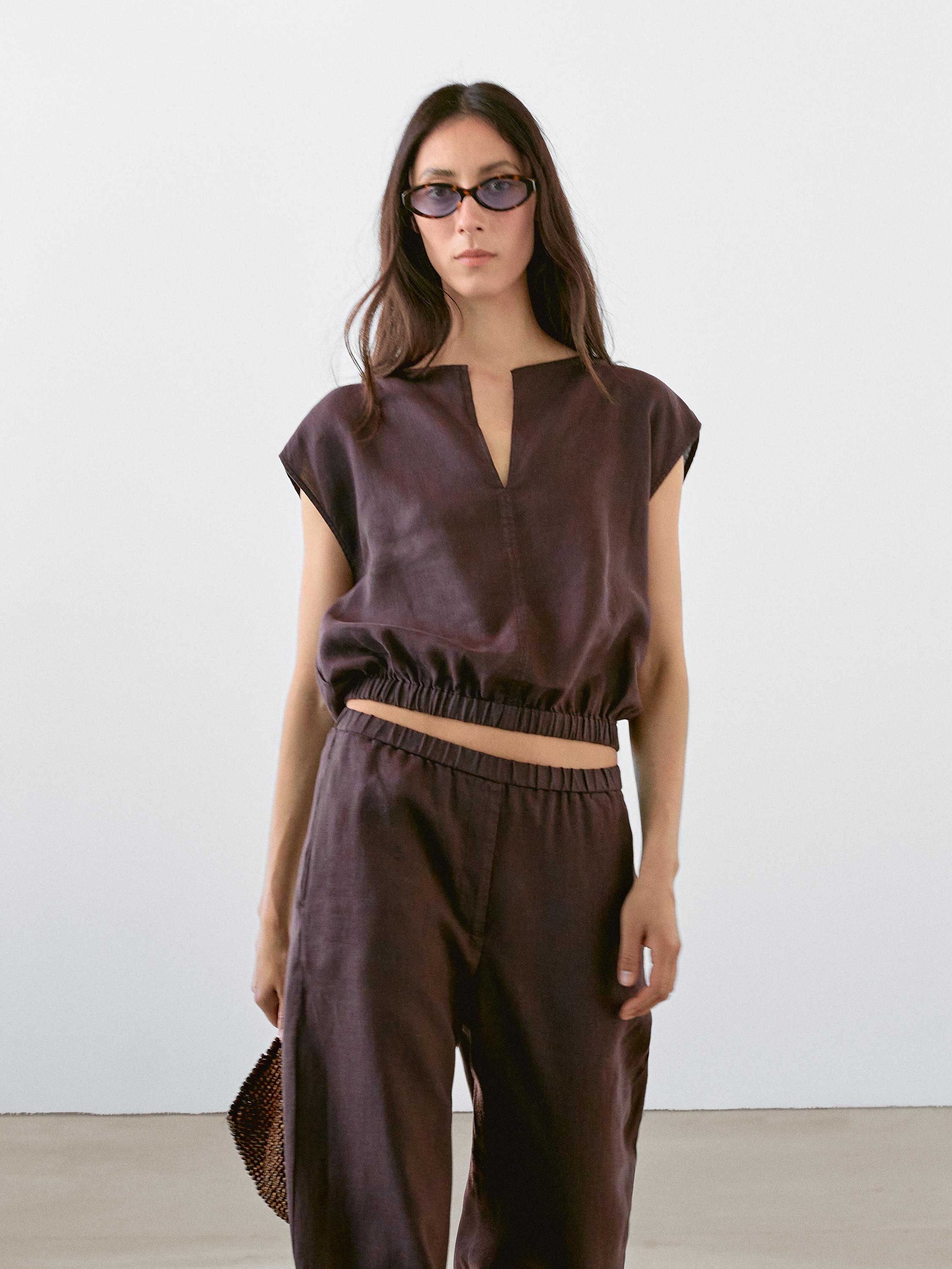 Linen blouse with elasticated hem