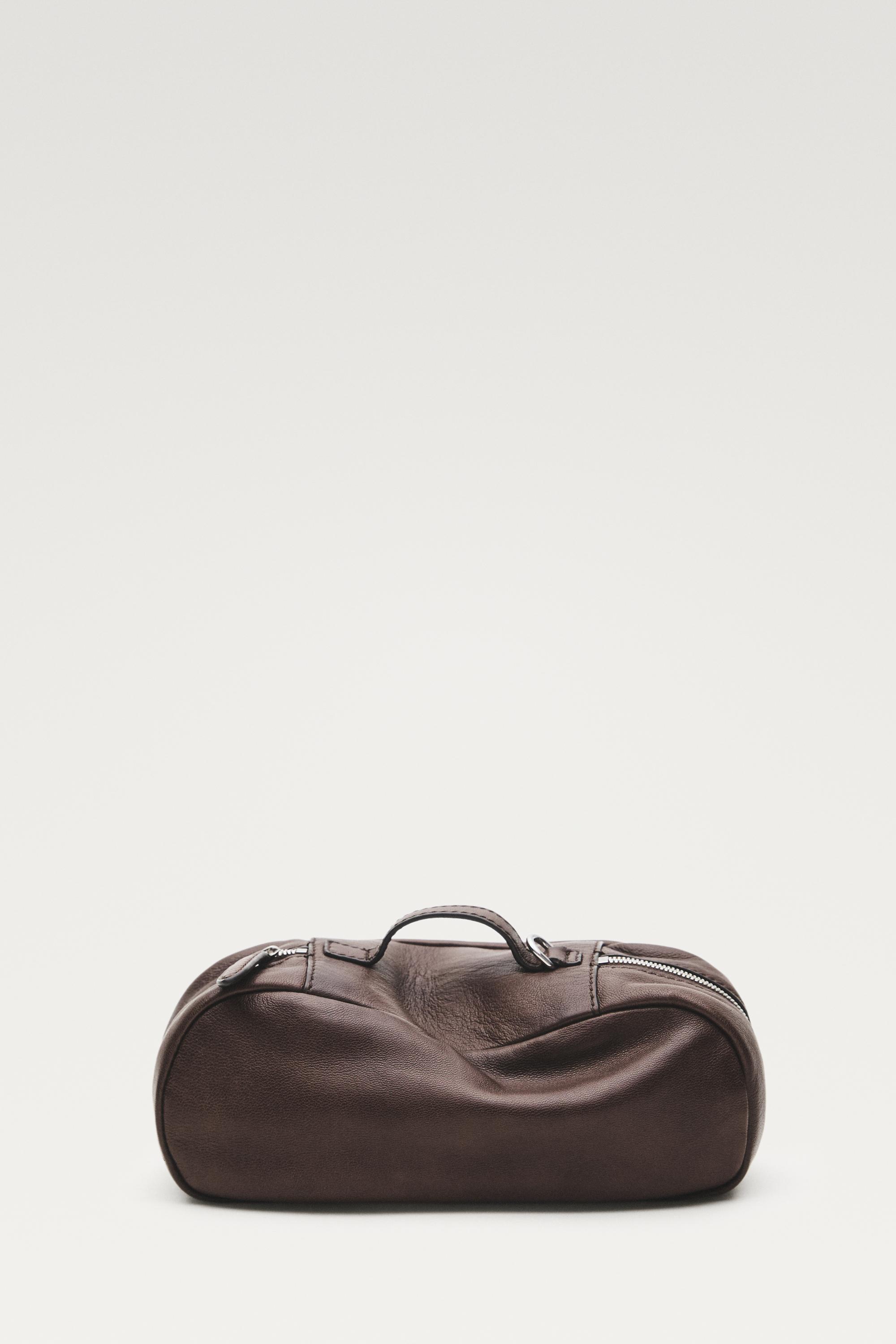 Oval nappa leather toiletry bag — BROWN
