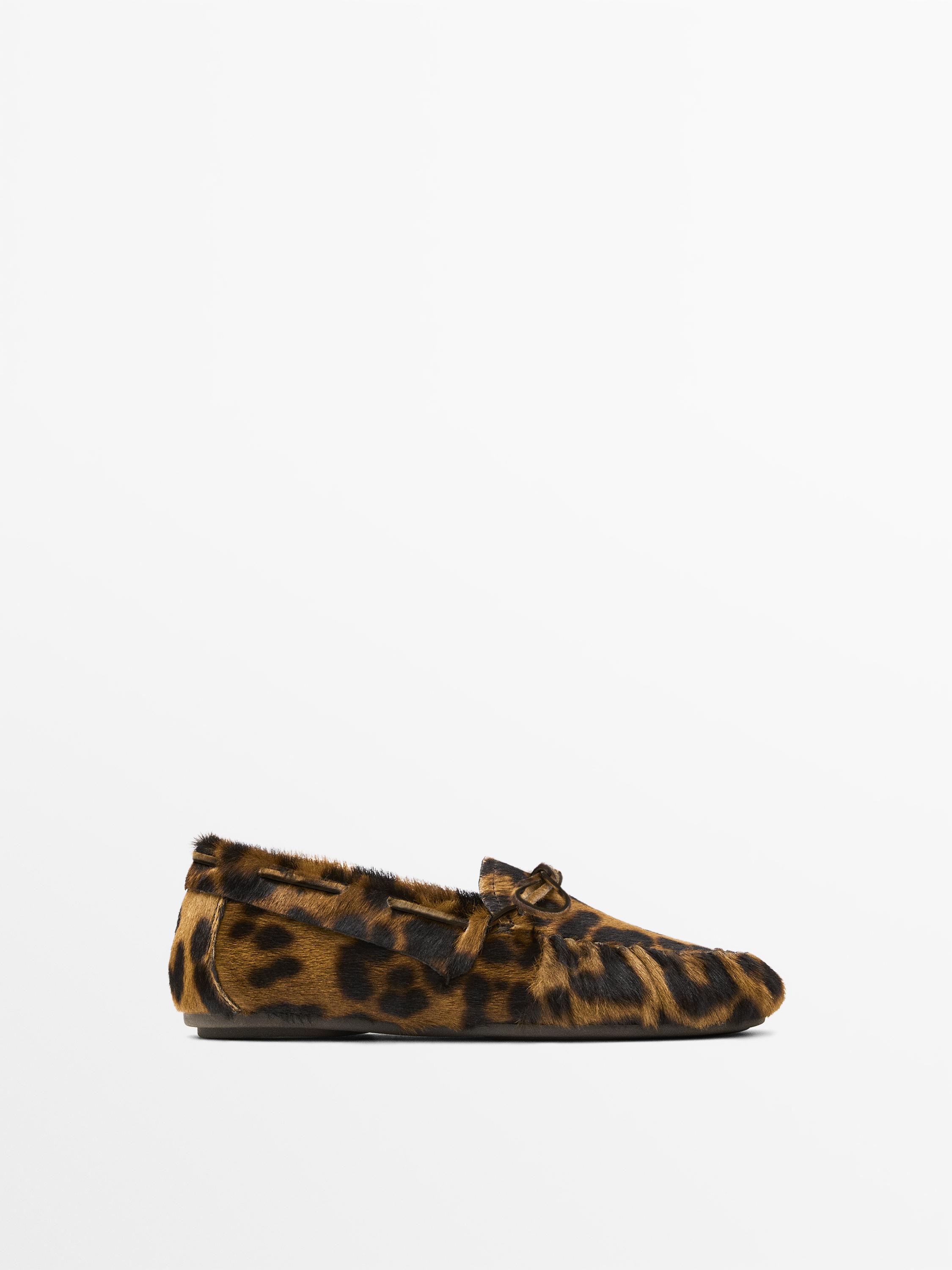 Animal print deck shoes