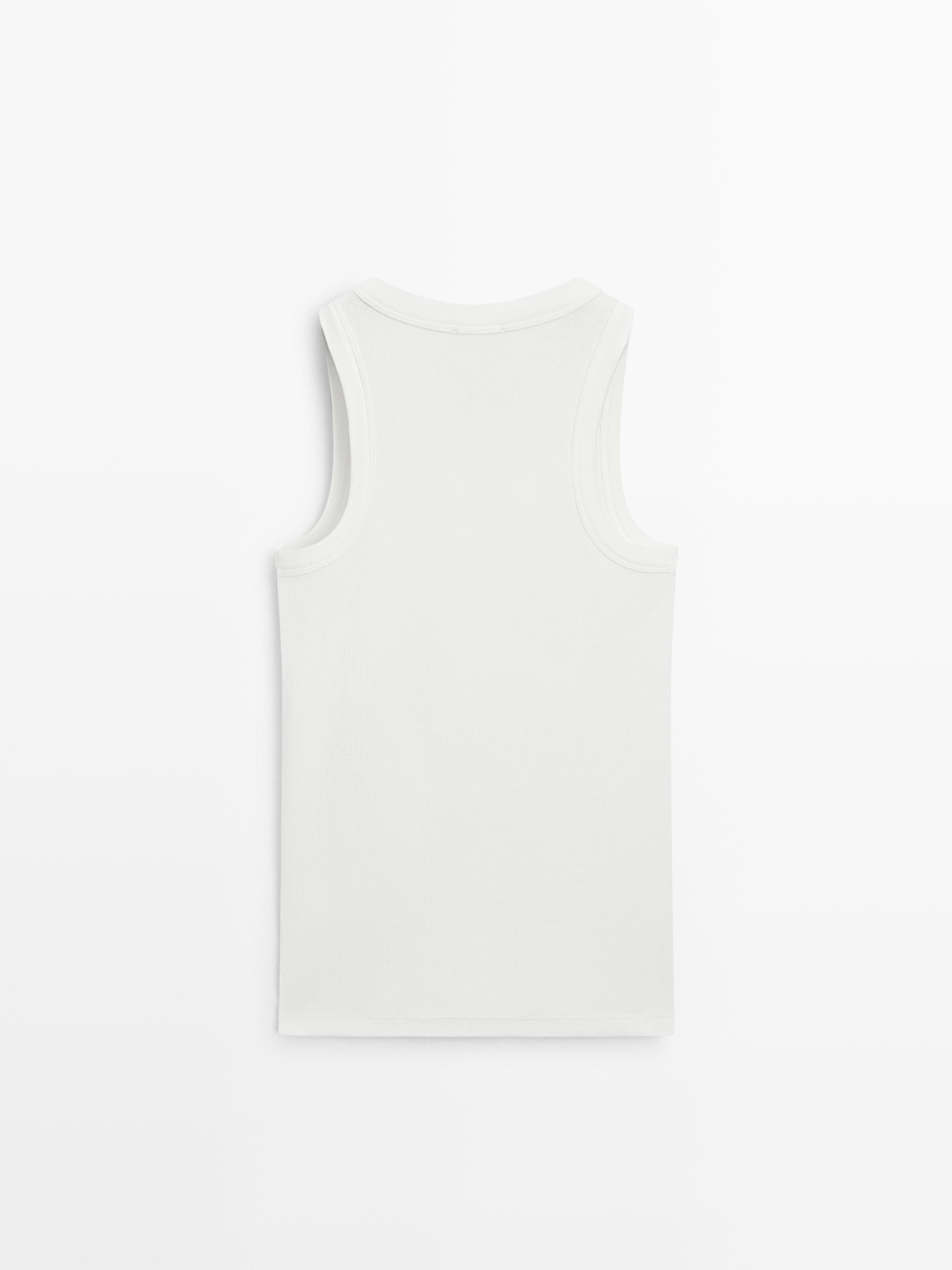 Back view of white sleeveless shirt.