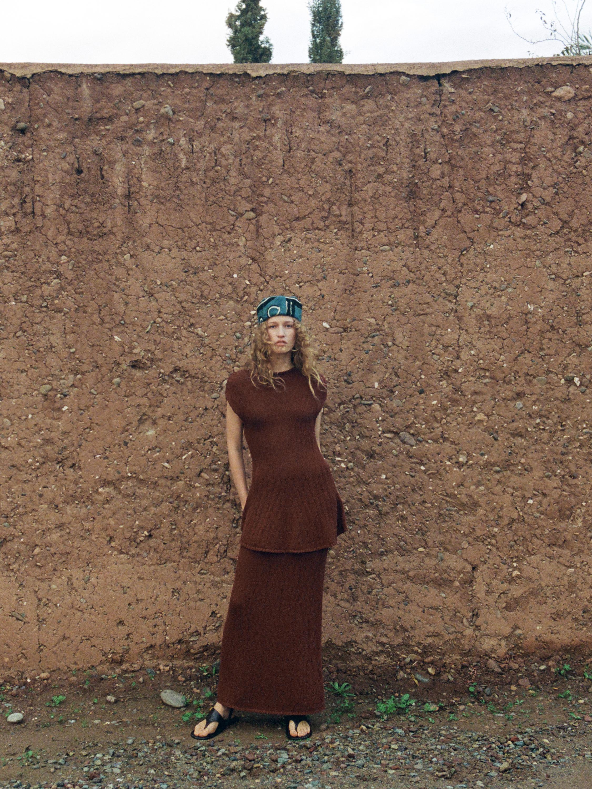 Cotton peplum knit top — RUSSET