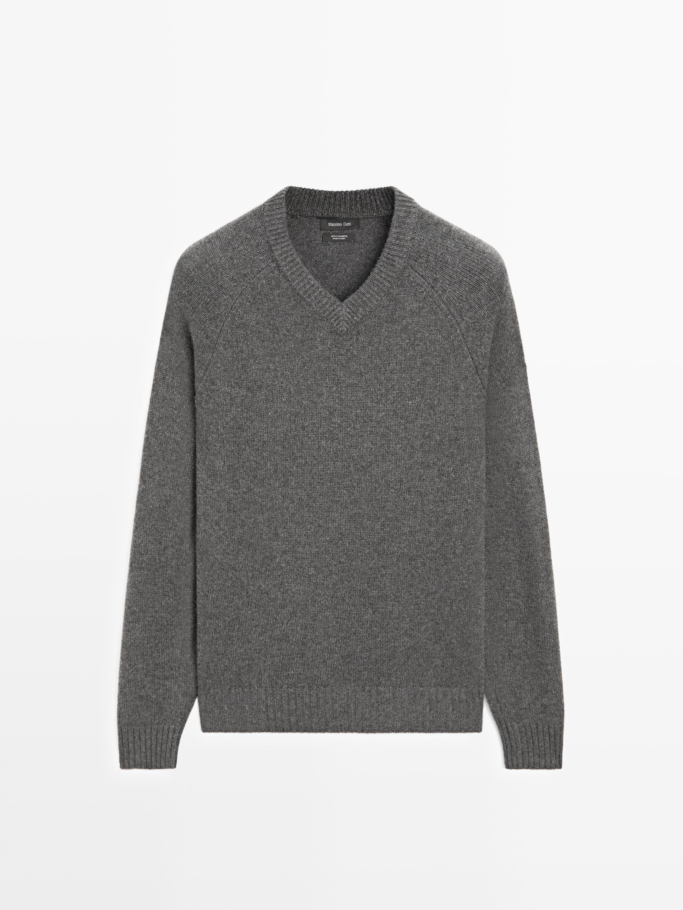 Front view of a medium gray V-neck long-sleeved sweater.