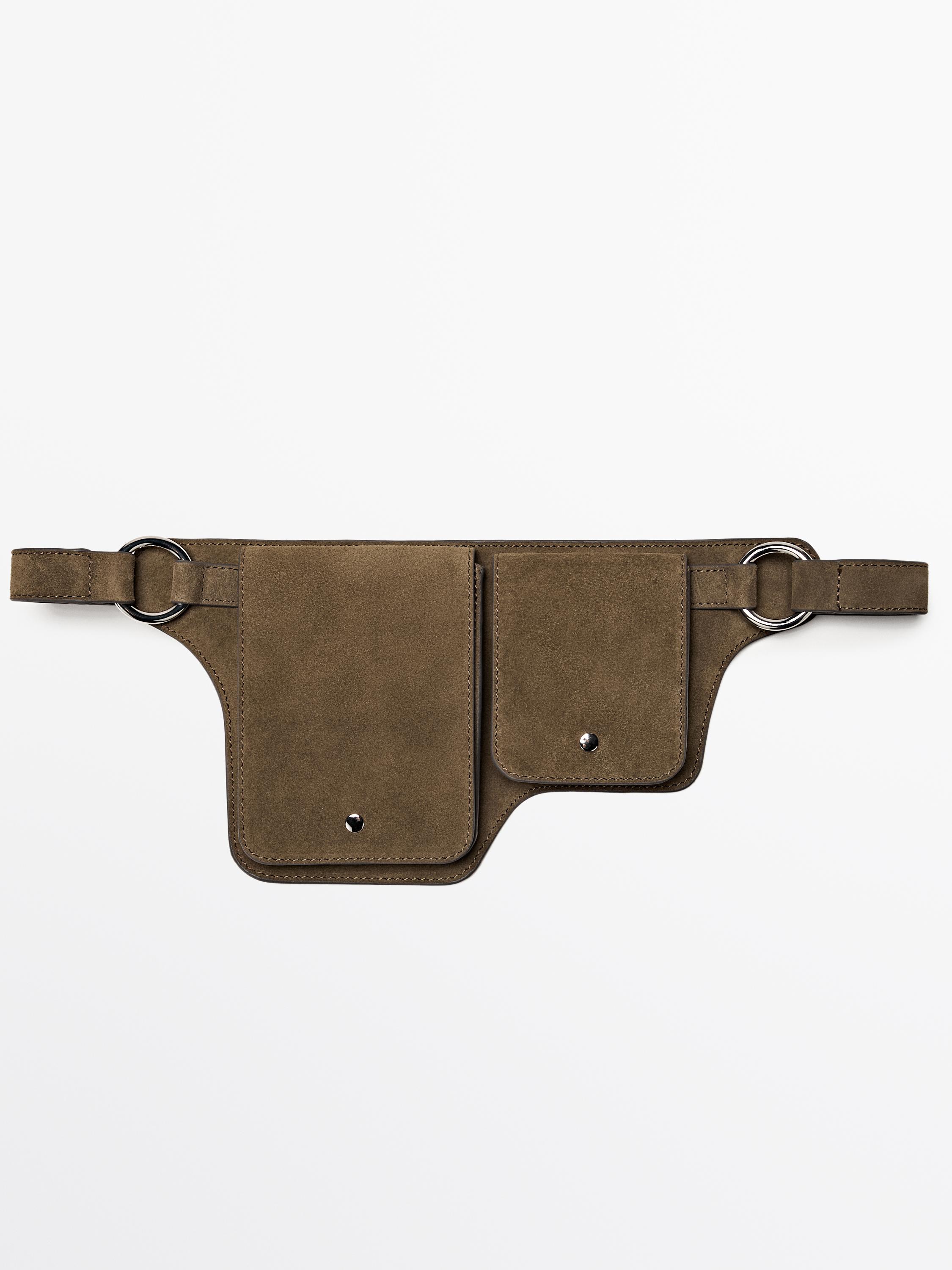 Front view of a khaki fanny pack with a double compartment and button closure, metallic ring details at the ends.