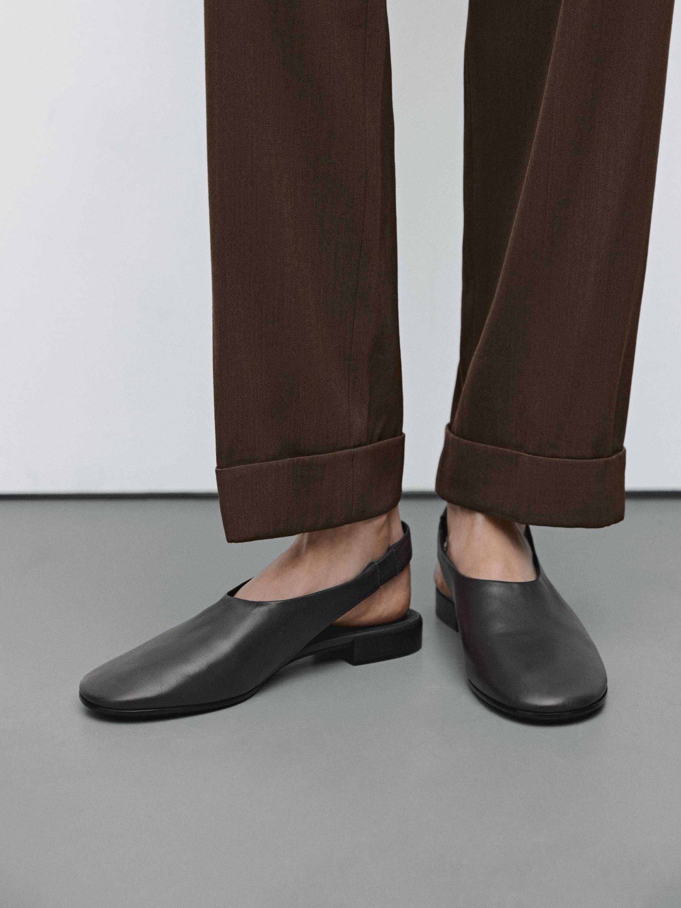 Suit trousers with turn-up hems