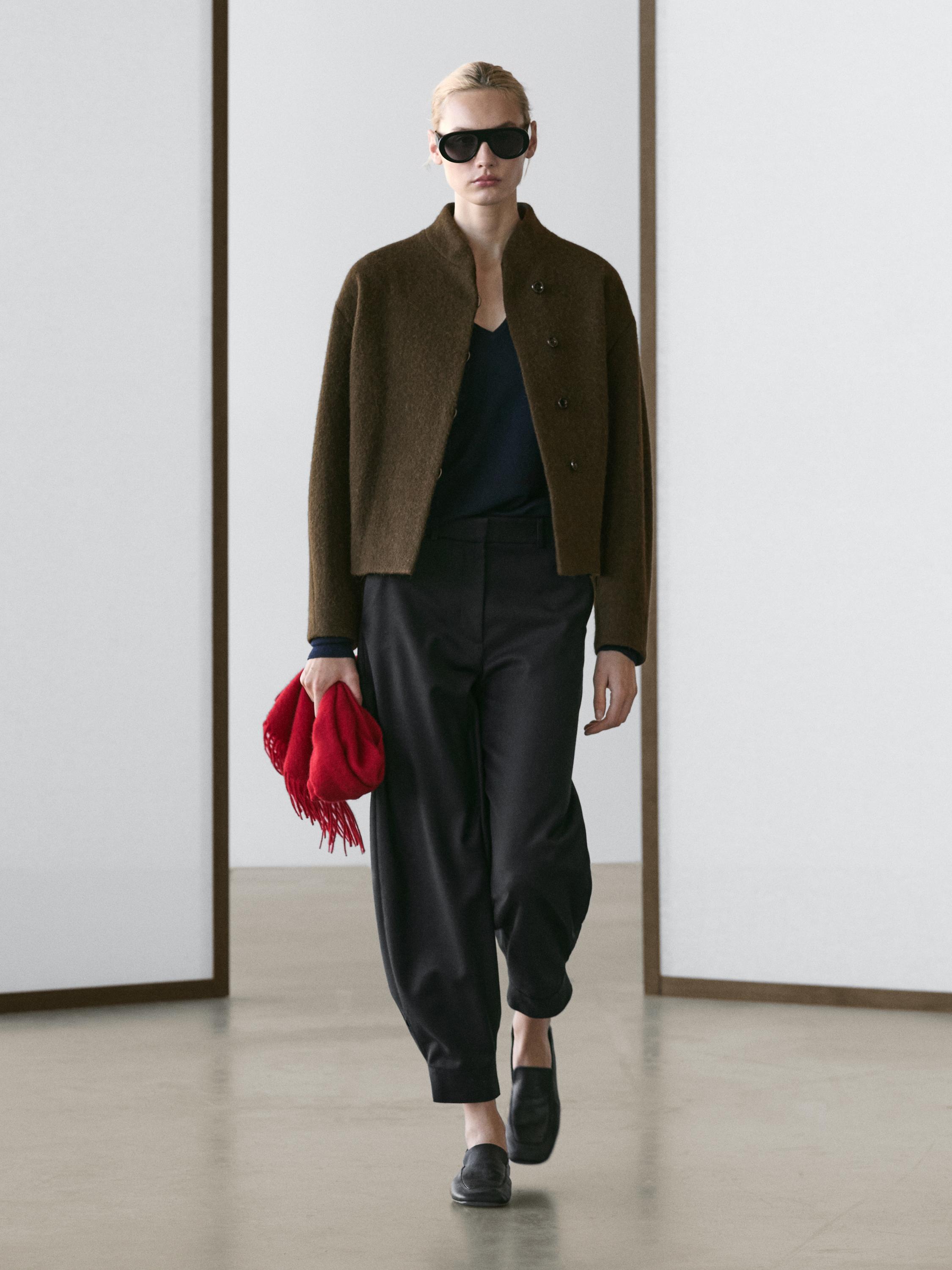 Brown button-up jacket and black baggy pants set.